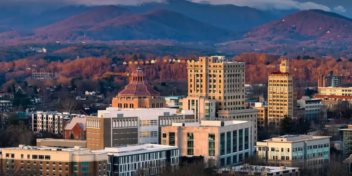 Asheville NC skyline with Blue Ridge mountains — Southern Star Roofing's Western NC office