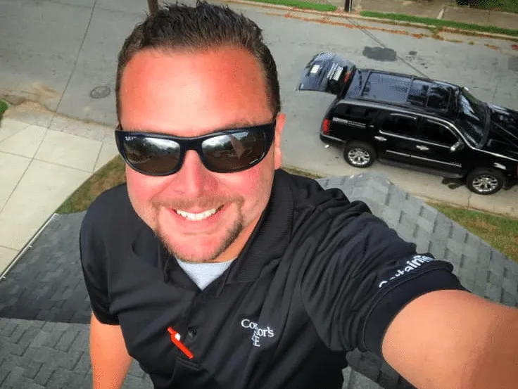 Brandon Johnson inspecting a roof in Charlotte